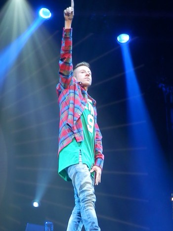 Macklemore commands the stage at the Wells Fargo Arena, Des Moines, Iowa.